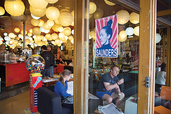 •Debbie Saunders' poster on Greens & Co. Photo by Bon Rose Askew.