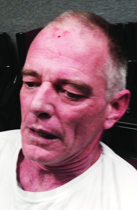 • Stuart Lofthouse moments after the scuffle when two Vincent rangers tried to remove him from the council chambers. Photos by David Bell