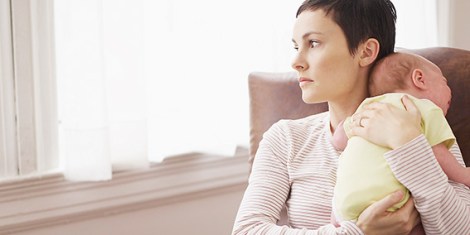 Mom Holding Baby And Looking out the Window