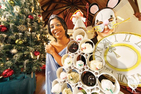 • Abigail Abishegam as Cinderella and Kristy Carroll as Mouse, hiding among the Christmas trees. Photo by Matthew Dwyer