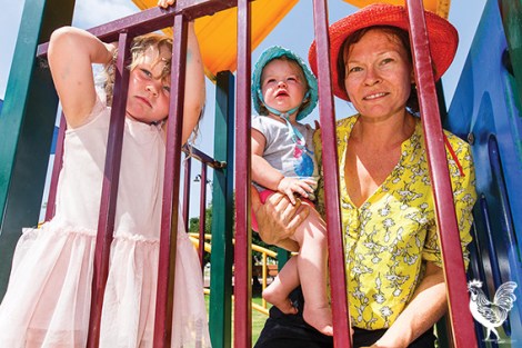 • FAILING THE TEST: Taryn Austla’s kiddies, Abbe and Karri, don’t like playing on metal equipment when it’s hot. They’re keen on climbing logs under the shade of a tree as part of Bayswater council’s plans for a nature playground at Bert Wright Park. Photo by Matthew Dwyer