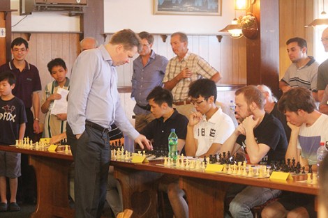 • Grandmaster Nigel Short makes a move against Patrick Gong — to no avail. Photo supplied