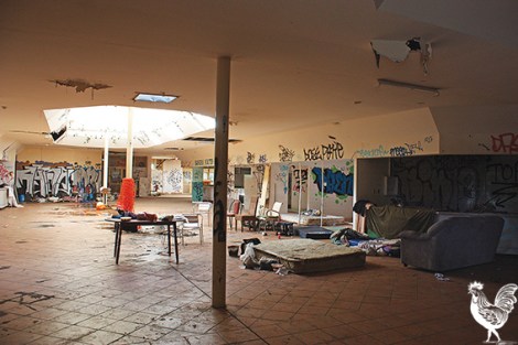 • Every year or so homeless people clamber into this run-down food hall. Our photographer was suprised to discover he’d captured burning embers in an unattended fire. Photos by Steve Grant