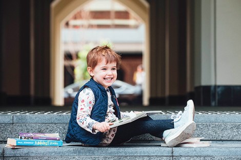 • Kids get a chance to swap books they’ve already read for something new at the Cathedral Square markets. Photo by Rachael Barrett