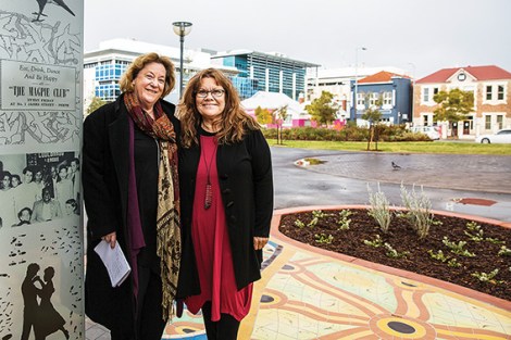 • Artists Jenny Dawson and Sandra Hill with their tilework and storytelling pillar. Photo courtesy www.studiophotopronto.com