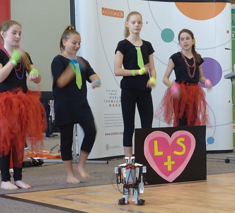 • Kids from St Paul’s lead their robot on a merry dance. Photo supplied