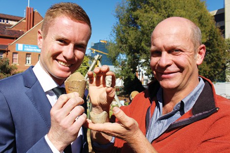 • WA heritage minister Albert Jacob with UWA archaeologist Sven Ouzman. They’re holding artefacts uncovered in a dig around the WA museum: two imported crucibles used in the old geological laboratory to smelt down minerals, and the bowl of a clay pipe found in the old gaol site. Photo supplied.