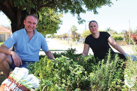 • Chris and Della Cornish tending their verge garden. Photo by Trilokesh Chanmugam