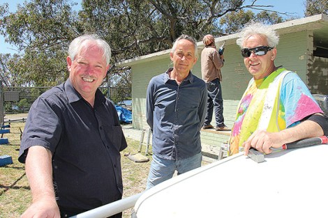 • Bayswater mayor Barry McKenna, Kevin Mack from the Friends of Claughton Reserve and artist Duncan Moon discuss toilet tourism while Xave Brown gets to work on the old concrete toilet block.