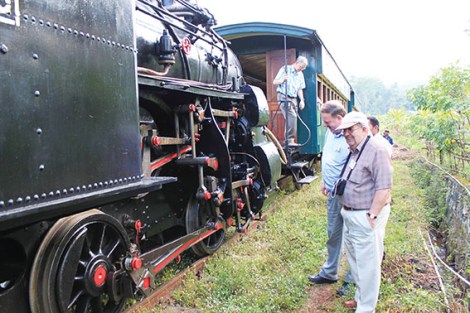 Tour leader Kevin Pearce and Murray Johnson of Cottesloe inspect the workings of the 114-year old rack locomotive.